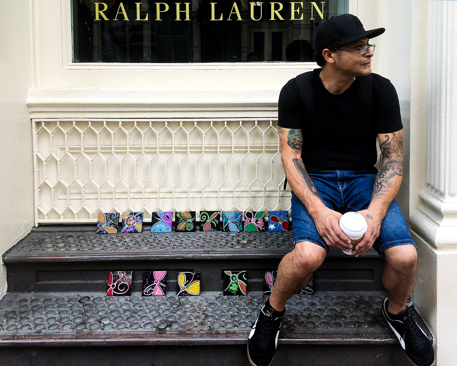 Christian Michael Gallegos with his hand-painted tiles in NYC